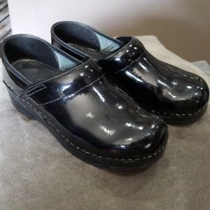 Dansko patent leather clogs